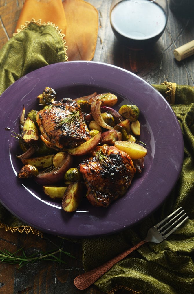 Balsamic-Red Wine Roasted Chicken and Vegetables. Tender, juicy, crispy-skinned chicken thighs brushed with a sweet and tangy reduction, served with roasted potatoes, brussels sprouts, whole garlic cloves, and red onion. Talk about flavorful. | hostthetoast.com