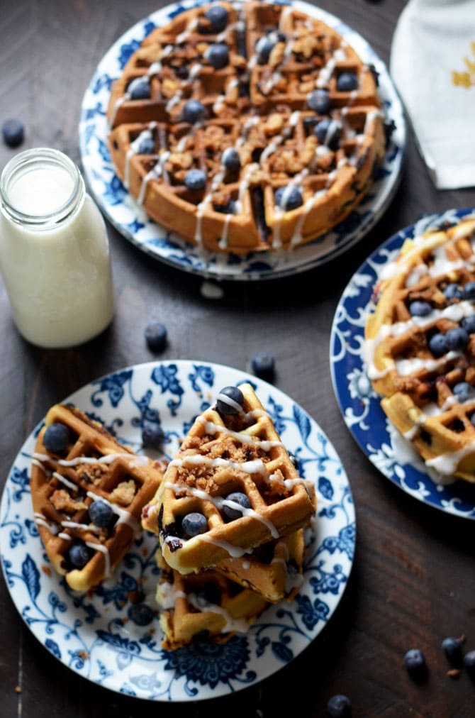 Blueberry Muffin Waffles with Streusel and Vanilla Glaze. These fresh blueberry loaded waffles are dense and taste just like bakery muffins but with a crisp, lightly toasted exterior. Make them a sweet treat with streusel and vanilla glaze, or simply serve them with a pat of butter. Great for a breakfast or brunch get-together. | hostthetoast.com
