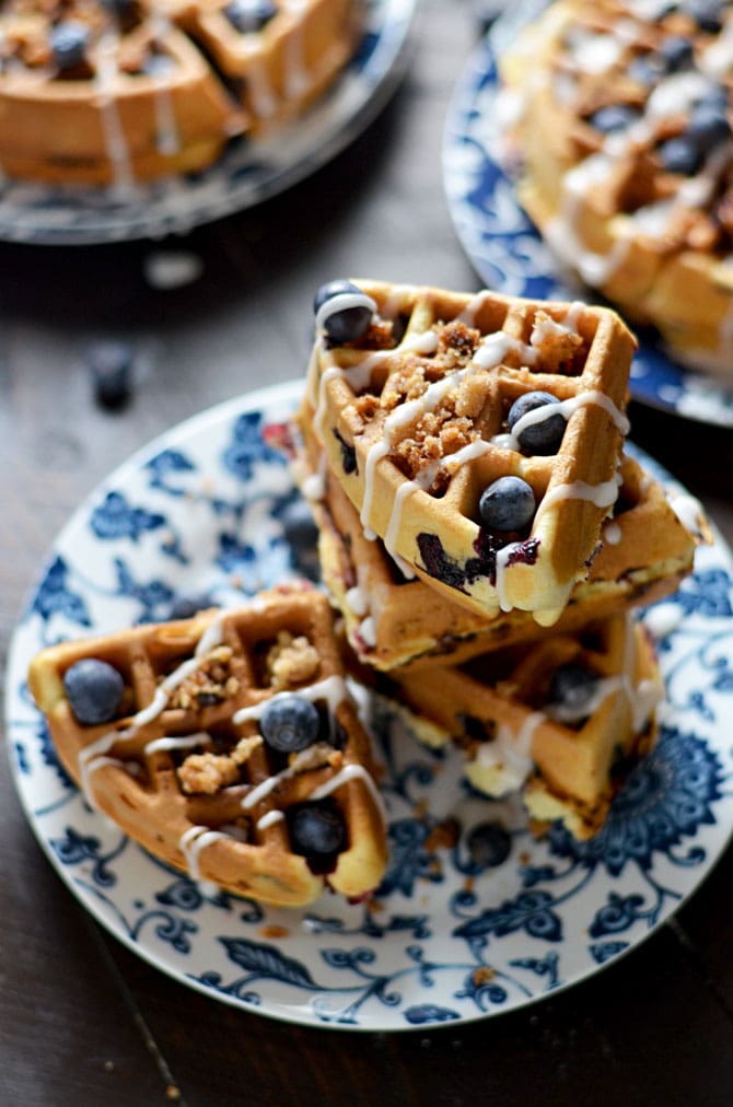 Blueberry Muffin Waffles with Streusel and Vanilla Glaze. These fresh blueberry loaded waffles are dense and taste just like bakery muffins but with a crisp, lightly toasted exterior. Make them a sweet treat with streusel and vanilla glaze, or simply serve them with a pat of butter. Great for a breakfast or brunch get-together. | hostthetoast.com