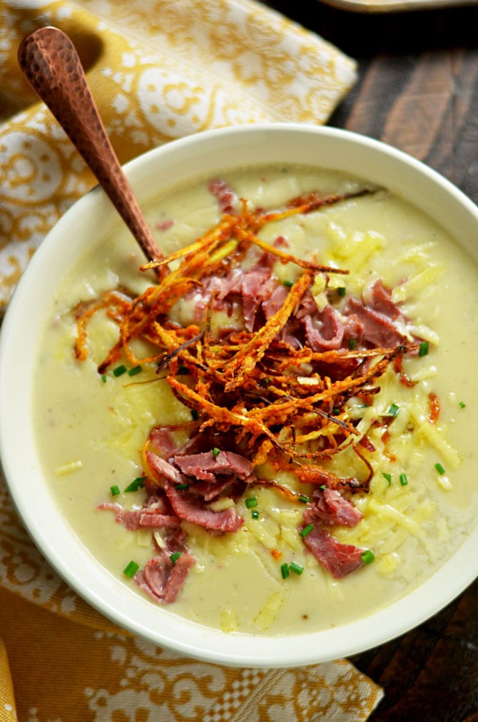 Irish Baked Potato Soup with Corned Beef and Crispy Leeks. This loaded, creamy soup tastes even better than the typical loaded baked potato soup. A great treat for St. Patrick's Day and beyond. | hostthetoast.com