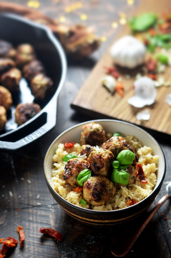 Sun-Dried Tomato Basil Chicken Meatballs with Creamy Parmesan Rice. Tender chicken meatballs, studded with sun dried tomatoes, fresh basil, and plenty of garlic over creamy, parmesan and garlic rice will become a new family favorite dinner. | hostthetoast.com