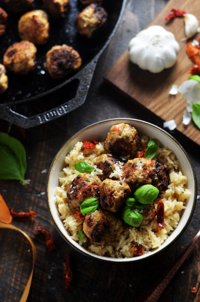 Sun-Dried Tomato Basil Chicken Meatballs with Creamy Parmesan Rice. Tender chicken meatballs, studded with sun dried tomatoes, fresh basil, and plenty of garlic over creamy, parmesan and garlic rice will become a new family favorite dinner. | hostthetoast.com