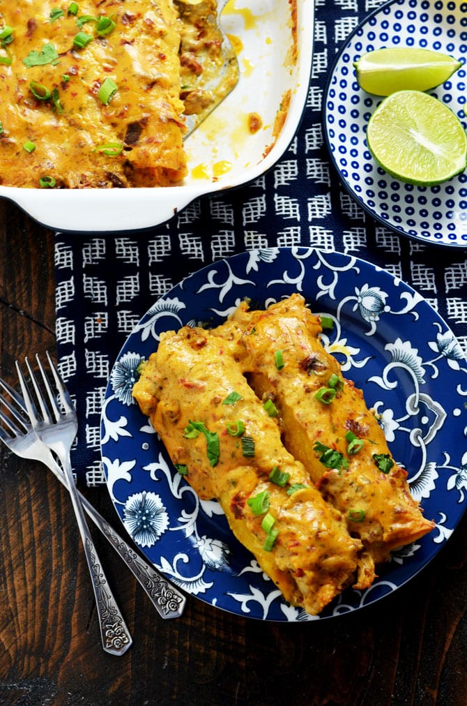 Creamy Three Cheese Chipotle Chicken Enchiladas. The title says it all. These slightly spicy, super cheesy, creamy, and ranch seasoned shredded chicken enchiladas are one of my favorite meals to come out of my kitchen! | hostthetoast.com