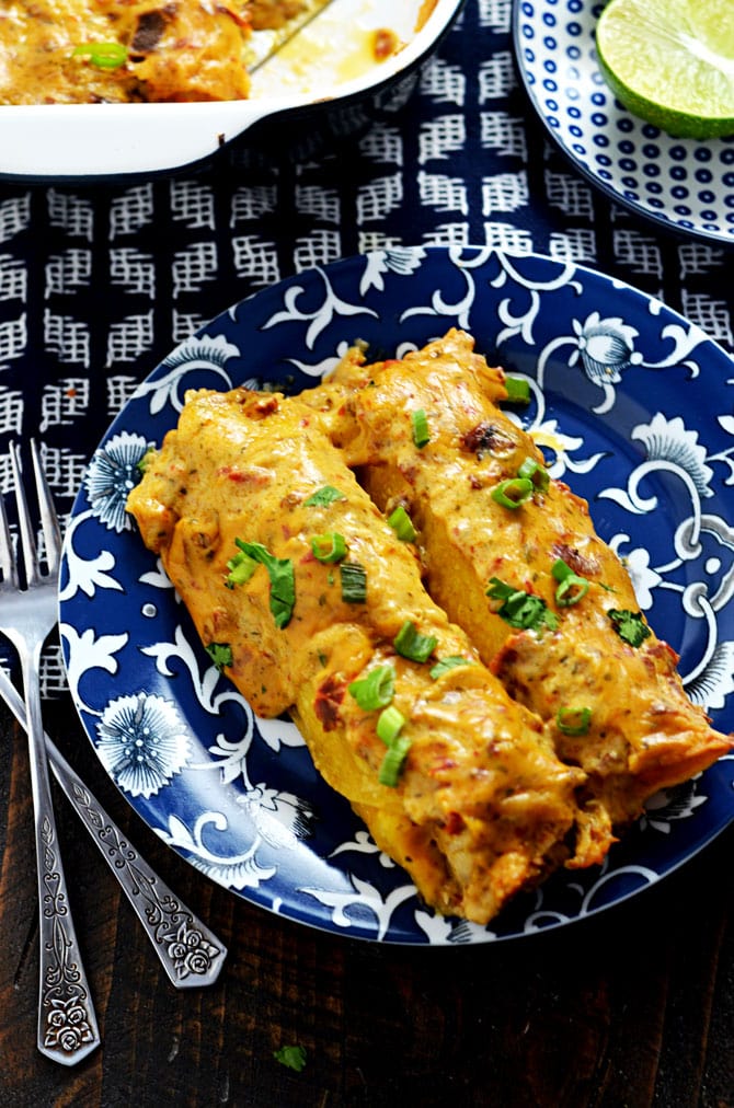 Creamy Three Cheese Chipotle Chicken Enchiladas. The title says it all. These slightly spicy, super cheesy, creamy, and ranch seasoned shredded chicken enchiladas are one of my favorite meals to come out of my kitchen! | hostthetoast.com