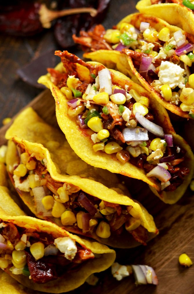 Crunchy Mexican BBQ Sauced Chicken Tacos with Charred Corn Relish. These tacos are sweet, tangy, and slightly spicy. But it's a secret ingredient in the Mexican BBQ sauce that makes them perfect. | hostthetoast.com
