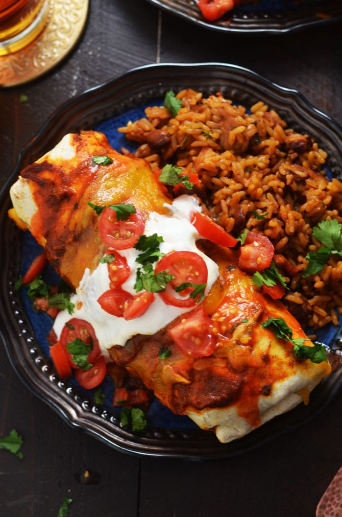 Slow Cooker Smothered Beef Burritos. These flavor-packed Tex-Mex burritos feature crock pot shredded beef and a seriously delicious tomato-chili gravy! | hostthetoast.com