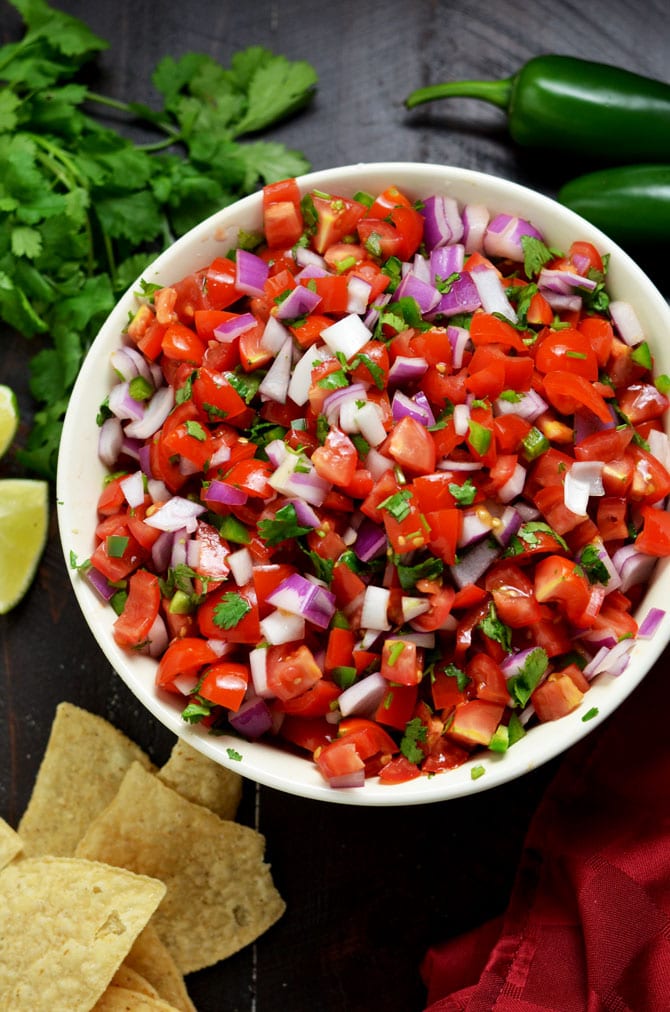 4 Must-Make Salsas: Pico de Gallo, Spicy Salsa Verde, Blended Chipotle-Tomato Salsa, and my personal favorite, Peach-Habanero Salsa. My friends always beg for these recipes, so I finally decided to share them. | hostthetoast.com