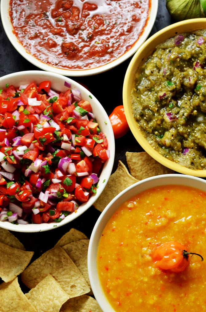 4 Must-Make Salsas: Pico de Gallo, Spicy Salsa Verde, Blended Chipotle-Tomato Salsa, and my personal favorite, Peach-Habanero Salsa. My friends always beg for these recipes, so I finally decided to share them. | hostthetoast.com