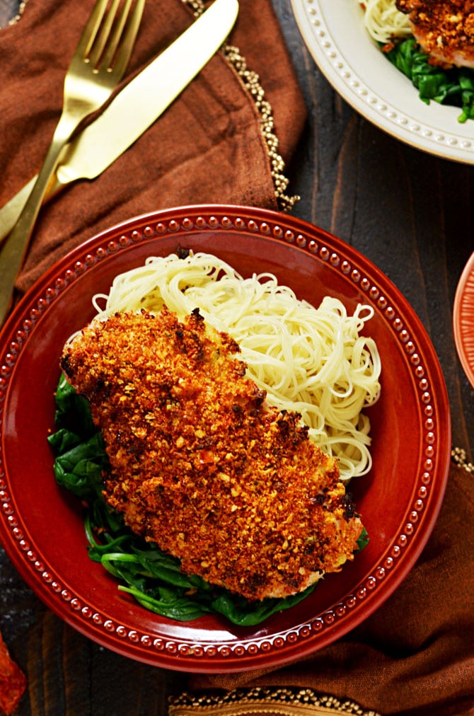 Sun Dried Tomato Crusted Chicken with Goat Cheese and Herb Sauce. Make chicken breasts into an exciting dinner that's easy enough for a weeknight but impressive enough for a date night. The crumb mixture gives the chicken crunch while a dijon mustard and light mayonnaise mixture keeps it moist! | hostthetoast.com