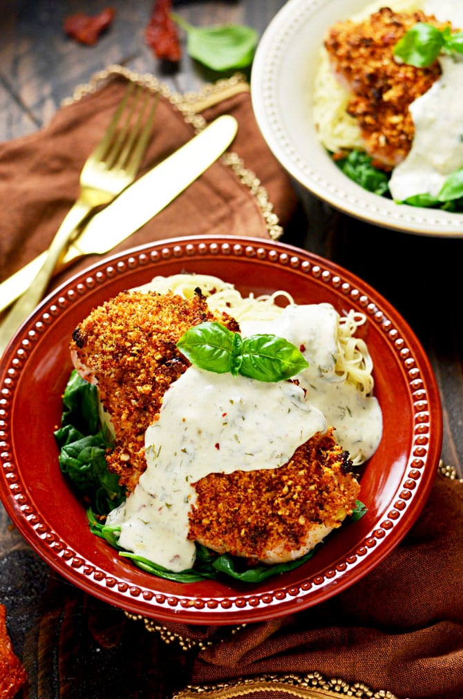 Sun Dried Tomato Crusted Chicken with Goat Cheese and Herb Sauce. Make chicken breasts into an exciting dinner that's easy enough for a weeknight but impressive enough for a date night. The crumb mixture gives the chicken crunch while a dijon mustard and light mayonnaise mixture keeps it moist! | hostthetoast.com