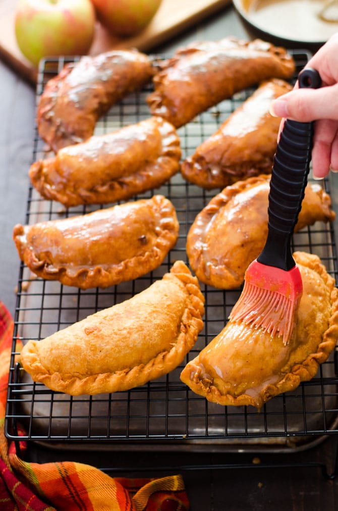 Maple Brown Butter Glazed Amish Apple Fry Pies. These sweet dessert snacks are hand-sized and perfect for a cold Fall day or Thanksgiving treat! | hostthetoast.com
