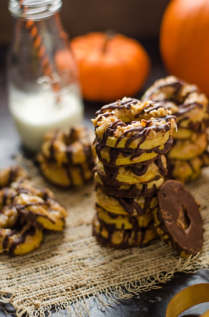 Nutella Pumpkin Samoa Cookies. The girl scout cookies you love just got better. These homemade cookies feature a pumpkin shortbread base, toasted coconut caramel topping, and nutella-chocolate drizzle. | hostthetoast.com