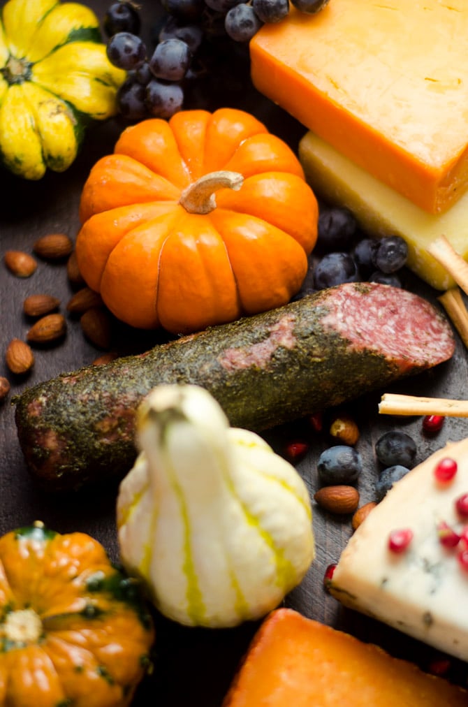 How To Make The Ultimate Autumn Harvest Cheese Board. Tips on selecting the best ingredients, plus recipes for Smoky Chipotle Pumpkin Hummus, Candied Bacon, and Bourbon Apple Butter! This is how you REALLY do Thanksgiving appetizers. | hostthetoast.com