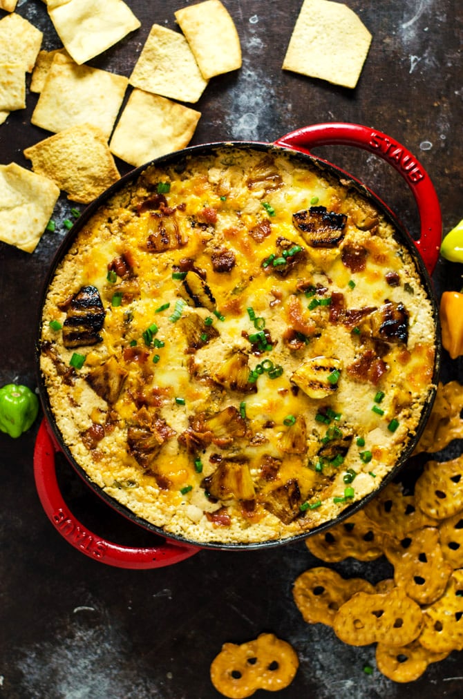 Cheesy Pineapple-Habanero Bacon Dip. This appetizer is sweet, savory, salty, tropical-tasting, and has just a bit of a kick to it. With each warm bite bursting with flavor, it will quickly become your most requested party food. | hostthetoast.com