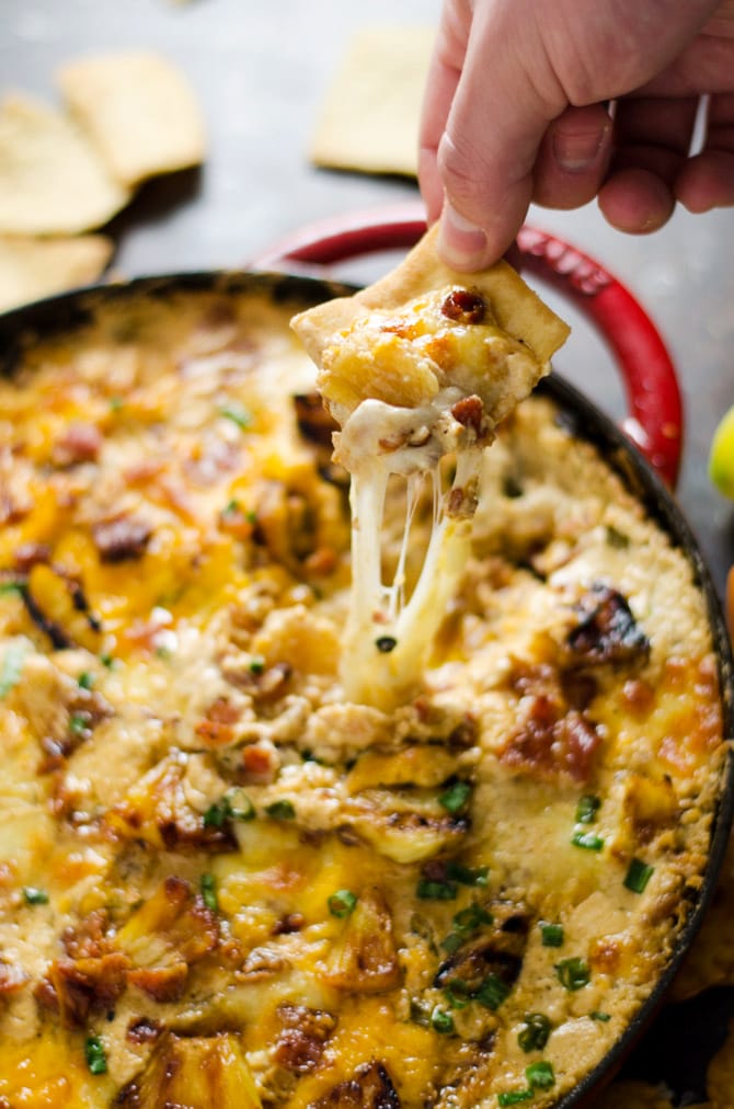 Cheesy Pineapple-Habanero Bacon Dip. This appetizer is sweet, savory, salty, tropical-tasting, and has just a bit of a kick to it. With each warm bite bursting with flavor, it will quickly become your most requested party food. | hostthetoast.com
