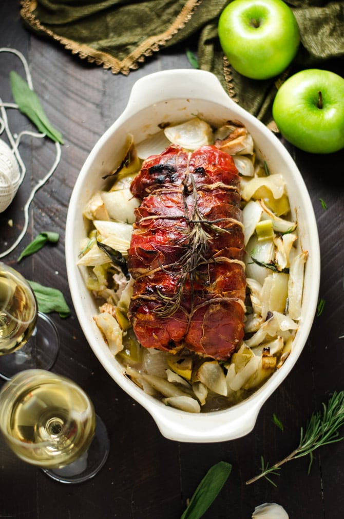 Prosciutto-Wrapped Pork Loin with Apple & Rice Stuffing. This all-in-one holiday meal is going to be a family favorite-- and is much easier to make than you'd imagine! | hostthetoast.com