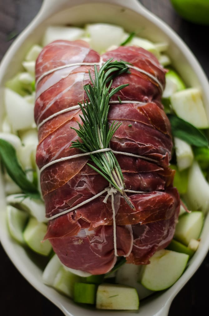 Prosciutto-Wrapped Pork Loin with Apple & Rice Stuffing. This all-in-one holiday meal is going to be a family favorite-- and is much easier to make than you'd imagine! | hostthetoast.com