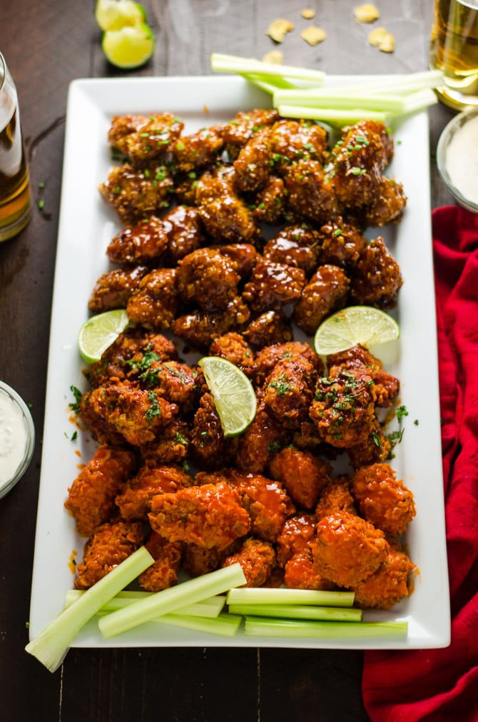 Baked Boneless Wings 4 Ways. Cornflake-coated chicken breast pieces are tossed in homemade Buffalo Sauce, Smoky Chipotle-Lime Sauce, Honey, Bourbon BBQ Sauce, and Orange Glaze. Simple, delicious, and a surefire crowd-pleaser. | hostthetoast.com