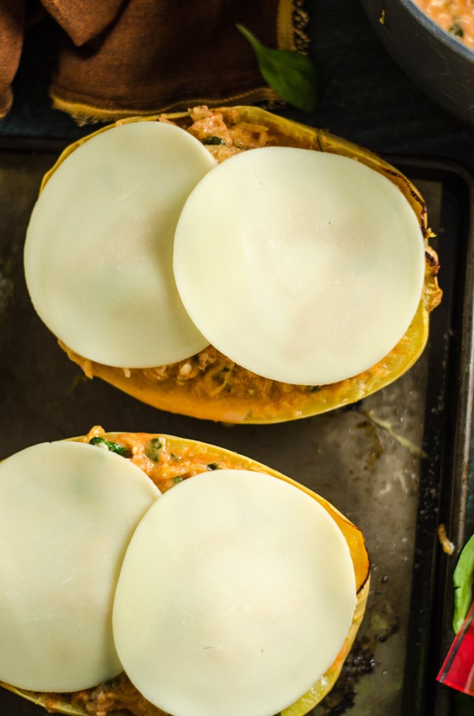Cheesy Tuscan Spaghetti Squash. This delicious dinner recipe features low-calorie roasted spaghetti squash, a creamy tomato-garlic yogurt sauce, spinach, and plenty of melted cheese. | hostthetoast.com
