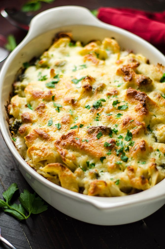 30 Minute Chicken and Broccoli Tortellini Alfredo Bake. This quick and easy weeknight dinner features juicy chicken chunks, tender broccoli, creamy homemade Alfredo sauce, velvety tortellini, and of course, plenty of cheese. | hostthetoast.com