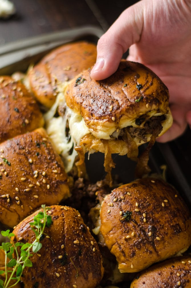 French Onion Beef Sliders For A Crowd. This is one appetizer recipe you don't want to skip. Serve it for the Super Bowl and watch how quickly these little sandwiches disappear. | hostthetoast.com