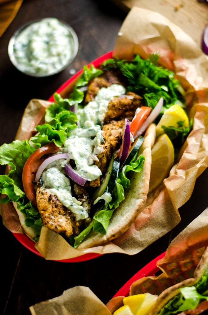 30 Minute Chicken Gyros with Tzatziki. These super easy-to-make Greek-style sandwiches are filled with lemony chicken and cooling cucumber tzatziki. Perfect for a weeknight! | hostthetoast.com