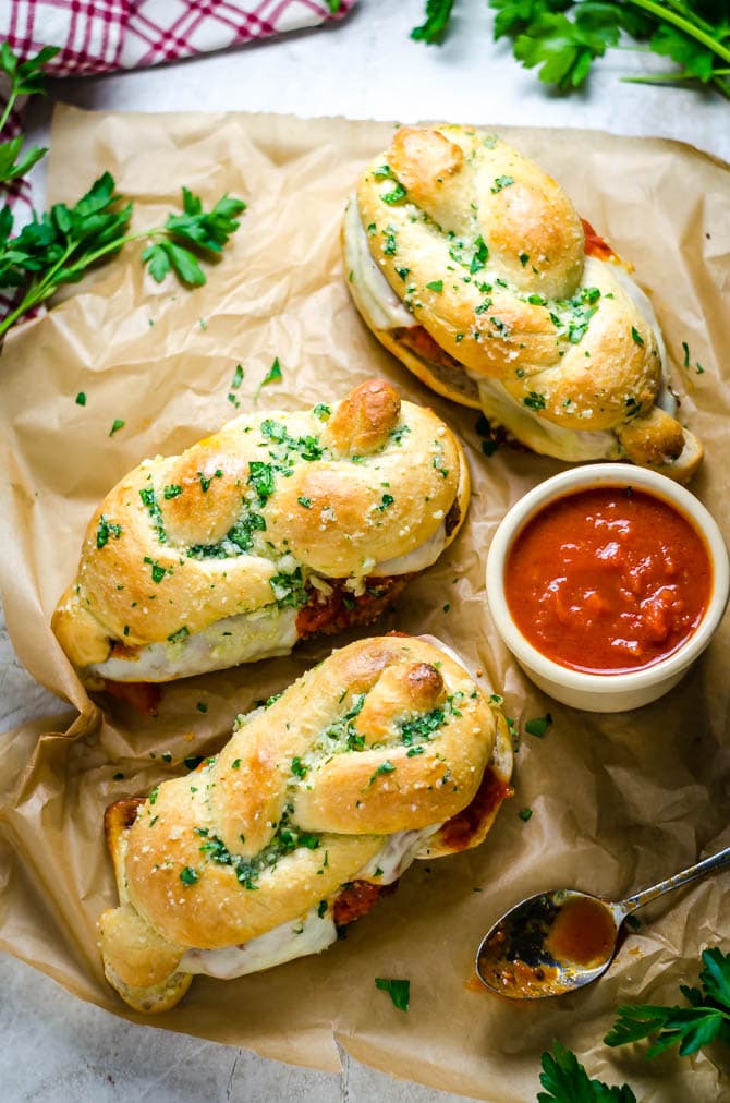 Garlic Knot Chicken Parmesan Sandwiches. Everything you love about a simple chicken parm, sandwiched between a jumbo garlic knot. How's that for dinner? | hostthetoast.com
