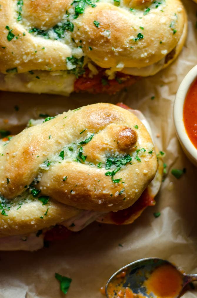 Garlic Knot Chicken Parmesan Sandwiches. Everything you love about a simple chicken parm, sandwiched between a jumbo garlic knot. How's that for dinner? | hostthetoast.com