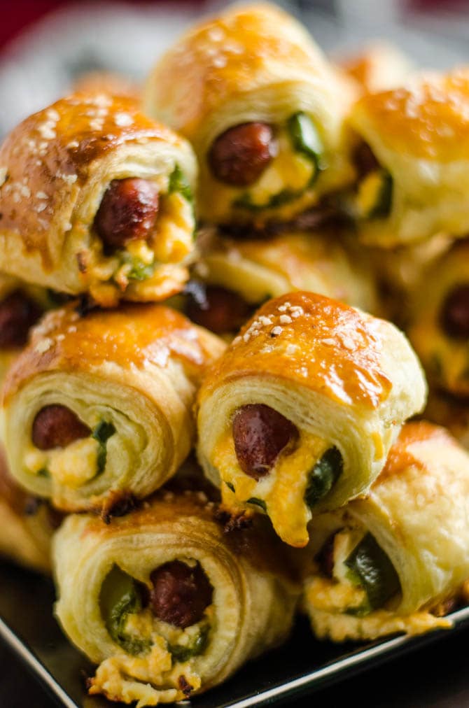 Jalapeno Popper Pigs in a Blanket. These spicy, cheesy appetizers are perfect for your next party or game day! | hostthetoast.com