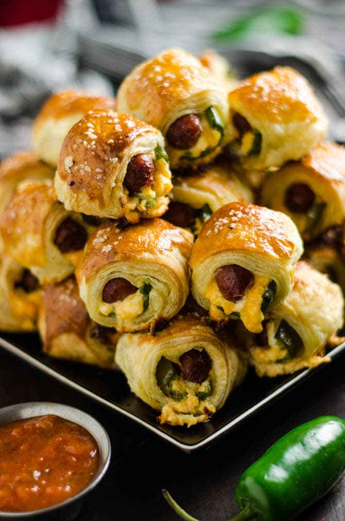 Jalapeno Popper Pigs in a Blanket. These spicy, cheesy appetizers are perfect for your next party or game day! | hostthetoast.com