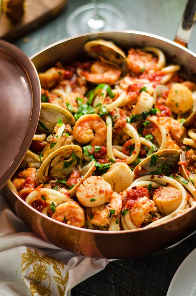 Seafood Fra Diavolo. This pasta dish is impressive for a date night or Valentine's Day dinner but easy enough to make at home! Loaded up with shrimp, scallops, clams, and crab, it doesn't get better than this. | hostthetoast.com