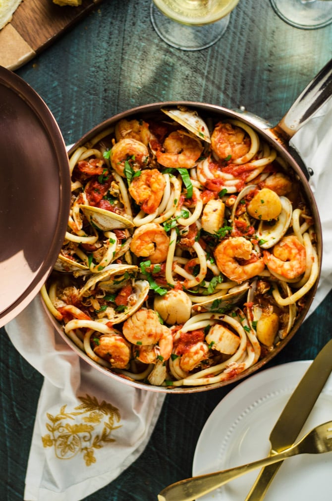 Seafood Fra Diavolo. This pasta dish is impressive for a date night or Valentine's Day dinner but easy enough to make at home! Loaded up with shrimp, scallops, clams, and crab, it doesn't get better than this. | hostthetoast.com