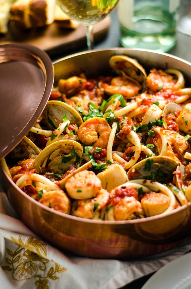 Seafood Fra Diavolo. This pasta dish is impressive for a date night or Valentine's Day dinner but easy enough to make at home! Loaded up with shrimp, scallops, clams, and crab, it doesn't get better than this. | hostthetoast.com