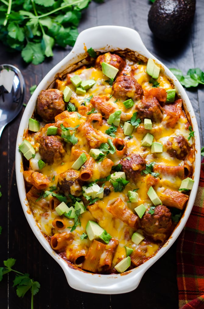 Enchilada Meatball Pasta Bake. This simple, saucy, cheesy dinner comes together all in one dish-- no pre-browning the meatballs or pre-boiling the pasta necessary. | hostthetoast.com