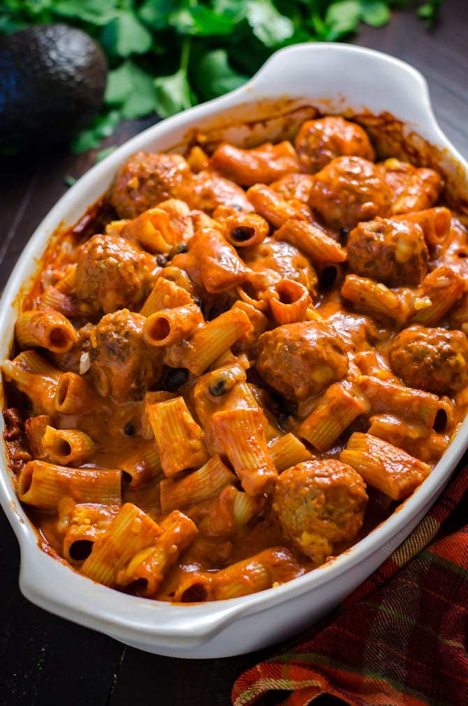 Enchilada Meatball Pasta Bake. This simple, saucy, cheesy dinner comes together all in one dish-- no pre-browning the meatballs or pre-boiling the pasta necessary. | hostthetoast.com