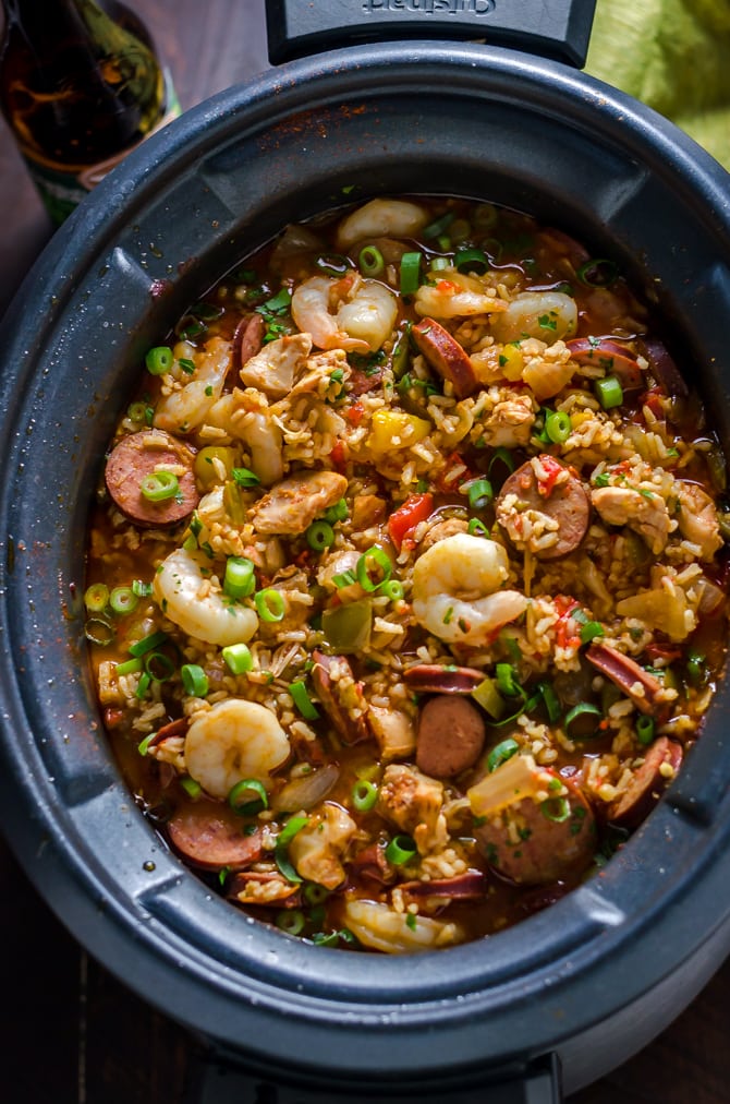 Slow Cooker Jambalaya. A low-effort meal that yields some high-level flavors, this cajun-inspired dish is loaded up with shrimp, chicken, and andouille sausage! | hostthetoast.com