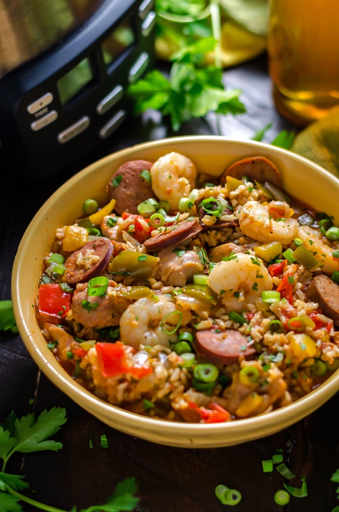 Slow Cooker Jambalaya. A low-effort meal that yields some high-level flavors, this cajun-inspired dish is loaded up with shrimp, chicken, and andouille sausage! | hostthetoast.com