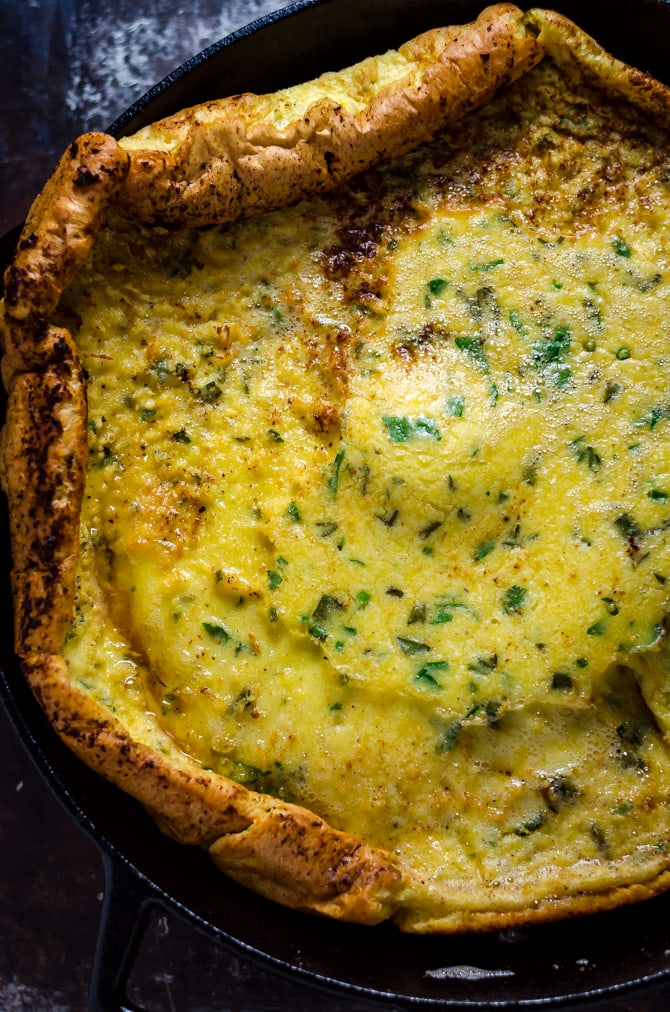 Dutch Baby Pesto Breakfast Pizza. This pancake-pizza hybrid is loaded up with herbs, prosciutto, shaved asparagus, burrata cheese, and eggs. Total brunch material. | hostthetoast.com