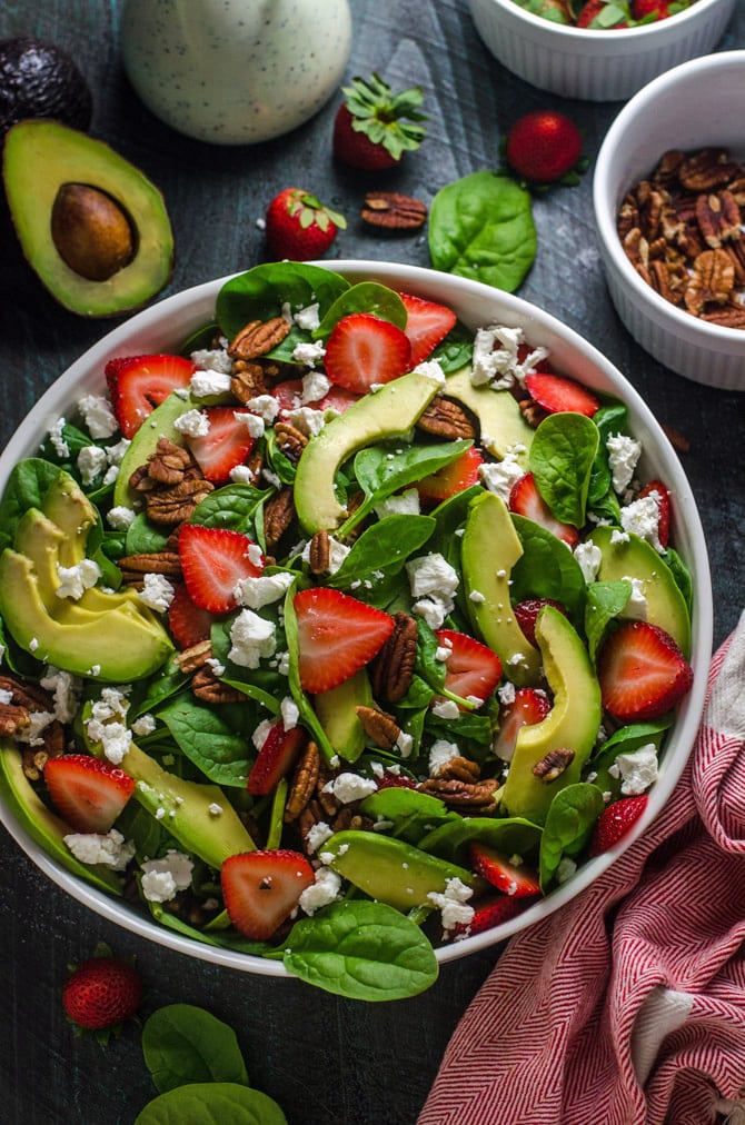 Strawberry Avocado Spinach Salad with Greek Yogurt Poppy Seed Dressing. This simple salad is full of creamy, crunchy, nutty, fruity, tangy, and summer-friendly flavors. You're gonna love it! | hostthetoast.com