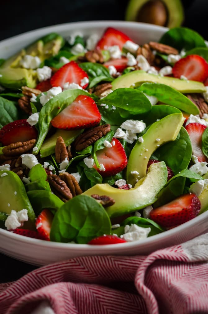 Strawberry Avocado Spinach Salad with Greek Yogurt Poppy Seed Dressing. This simple salad is full of creamy, crunchy, nutty, fruity, tangy, and summer-friendly flavors. You're gonna love it! | hostthetoast.com