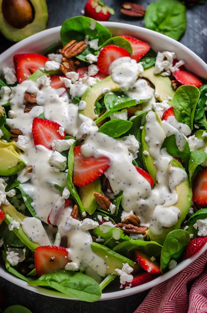 Strawberry Avocado Spinach Salad with Greek Yogurt Poppy Seed Dressing. This simple salad is full of creamy, crunchy, nutty, fruity, tangy, and summer-friendly flavors. You're gonna love it! | hostthetoast.com