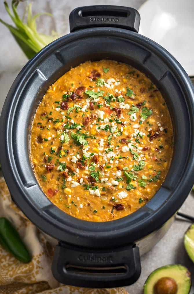 Slow Cooker Mexican Street Corn Chowder. This soup is loaded up with smoky, tangy, spicy, and salty flavors-- you're never going to want regular ol' corn chowder again. | hostthetoast.com