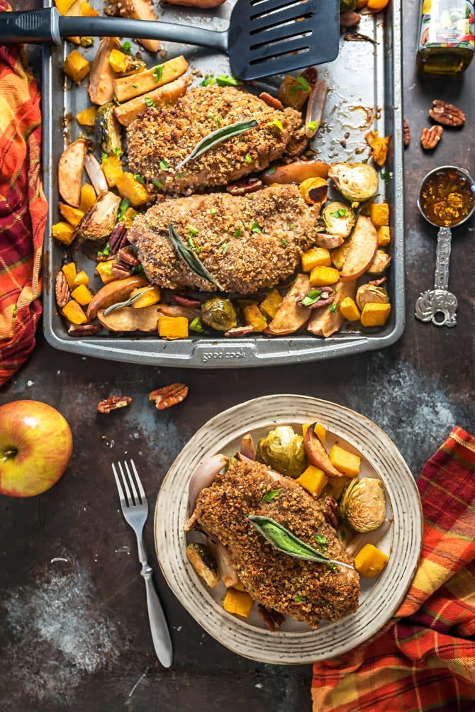 Sheet Pan Maple Pecan Crusted Chicken & Roasted Vegetables. 🍂 Want the flavors of fall in your dinner or meal plan dish? Loaded up with pecans, maple syrup, balsamic vinegar, Dijon mustard, sage, & fall veggies, this baked recipe will have you tasting autumn in every bite. | hostthetoast.com