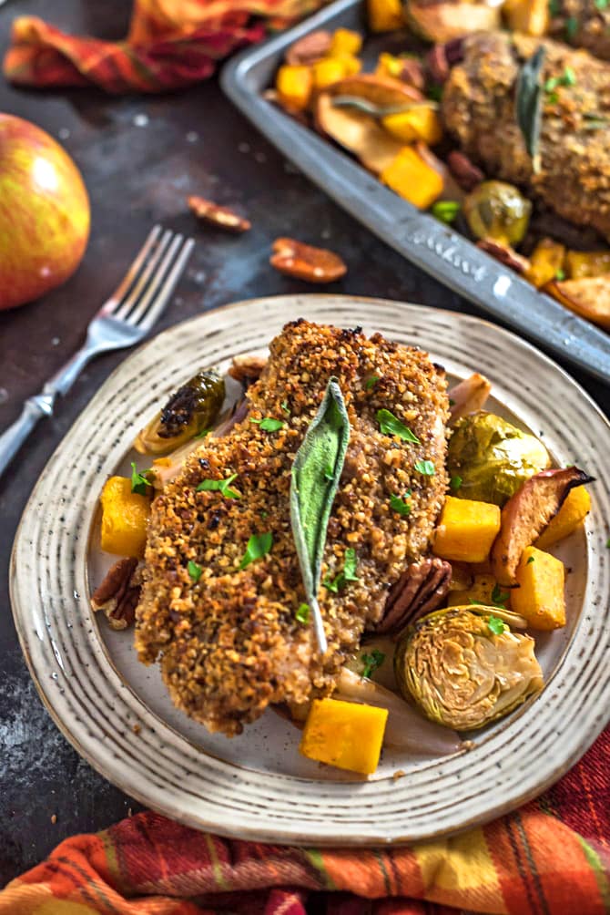 Sheet Pan Maple Pecan Crusted Chicken & Roasted Vegetables. 🍂 Want the flavors of fall in your dinner or meal plan dish? Loaded up with pecans, maple syrup, balsamic vinegar, Dijon mustard, sage, & fall veggies, this baked recipe will have you tasting autumn in every bite. | hostthetoast.com