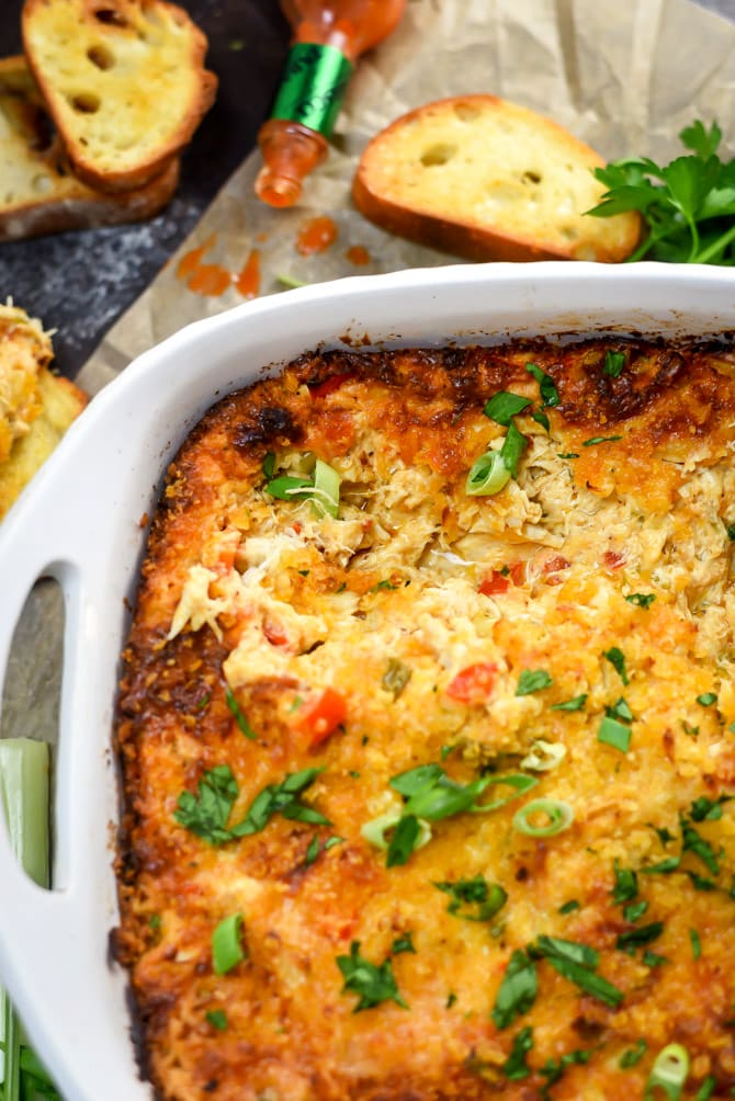 Hot Cajun Crab Dip. This cheesy, decadent dip is full of bold flavors and tender crab! | hostthetoast.com