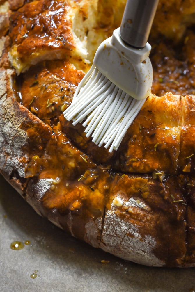 French Onion Blooming Bread Bowl. This cheesy, beefy, caramelized-onion loaded loaf is basically a fondue-ified version of French Onion Soup. | hostthetoast.com