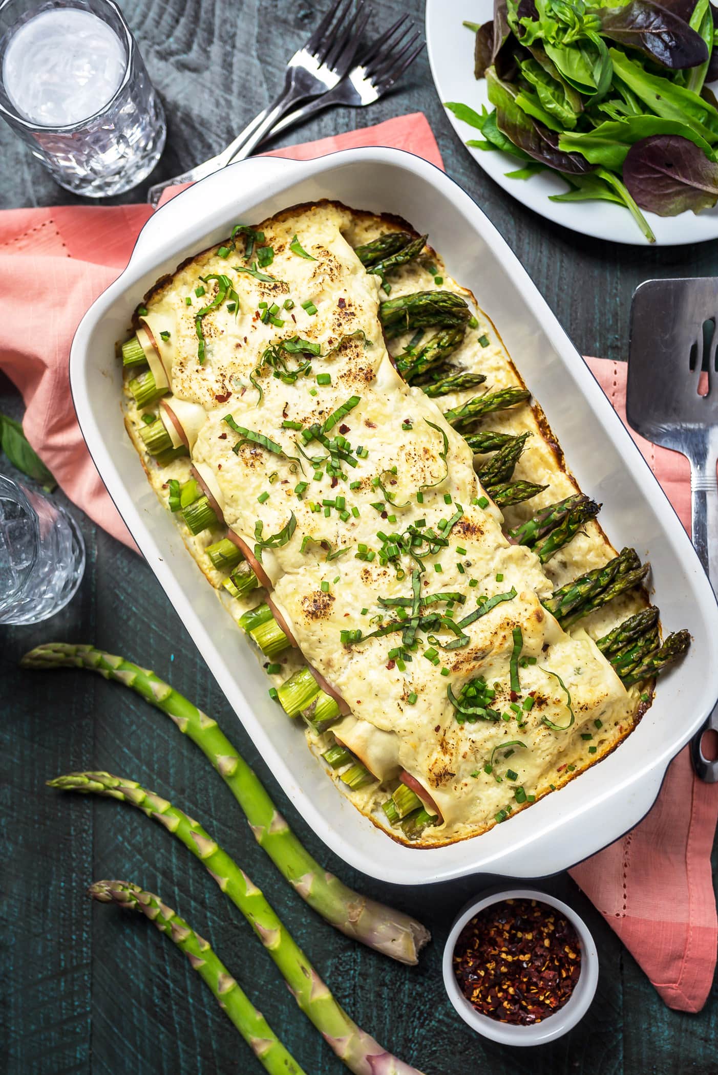 Cheesy Asparagus and Ham Cannelloni. An impressive dinner without a ton of effort. Lasagna sheets, deli-sliced ham, fresh asparagus, and a simple 3-cheese sauce come together to make a truly special dish for the family. | hostthetoast.com