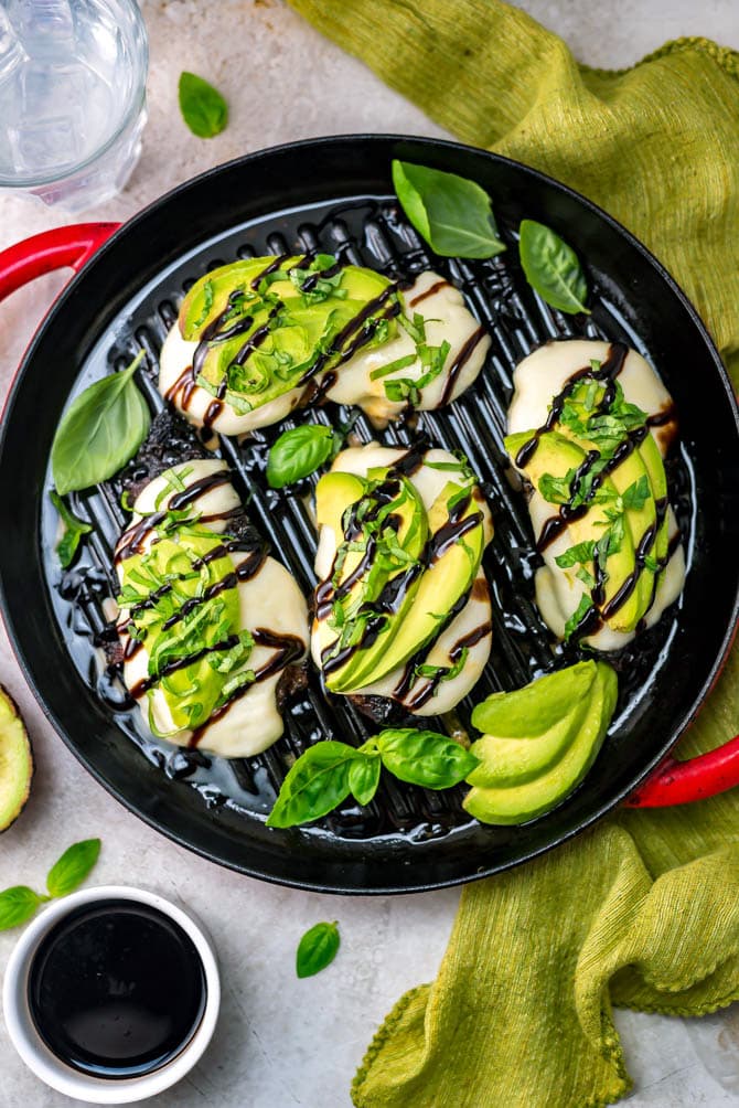Grilled Avocado Balsamic Chicken. A sweet and tart balsamic vinegar marinade, melted mozzarella cheese, tender grilled chicken, creamy avocado, fresh basil, and a balsamic drizzle come together to create a delicious, easy-to-make dinner. | hostthetoast.com