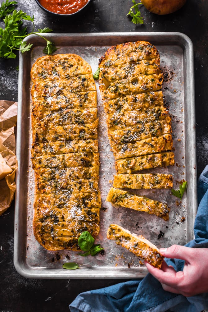 Caramelized Onion and Garlic Bread. A sweet garlic-onion-herb butter is smeared over spongy ciabatta, hit with plenty of parmesan, and baked until beautifully browned. | hostthetoast.com