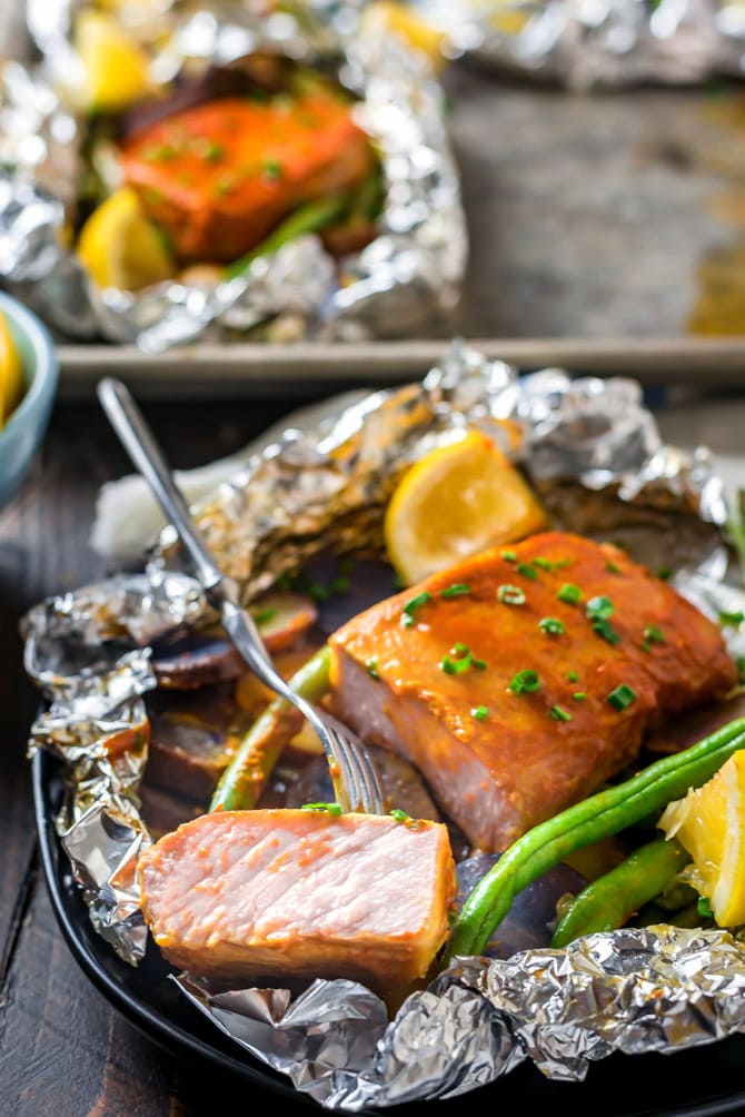 Sweet Mustard Pork and Potato Packets. They say good things come in small packages. These tangy, sweet, and smoky pork chop foil packets prove it-- and they’re extremely easy to make, to boot. | #ad @FrenchsFoods | hostthetoast.com